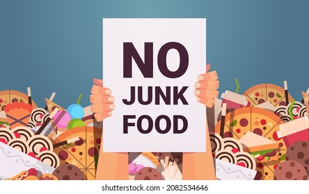 human hands holding no junk food placard unhealthy nutrition junkfood addiction stop fast food concept