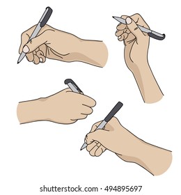 Human hands holding a pen and writing on paper