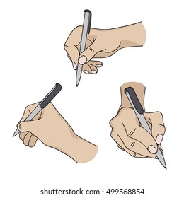 Human hands holding a pen and writing on paper.
