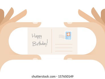 Human hands holding postcard with Birthday gift postal stamp and "Happy Birthday!" text. Idea - Happy Birthday congratulation postcard with free space for the name.