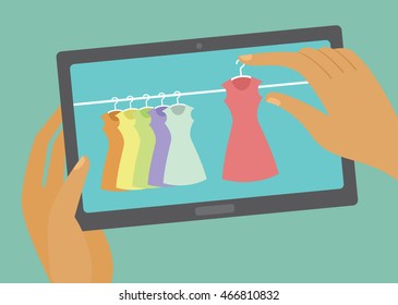 Human hands holding smart device with online shop open choosing dress