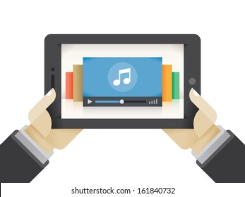 Human hands holding tablet computer with music player on the screen. Idea - Mobile collection of music, Cloud technologies for music collection.