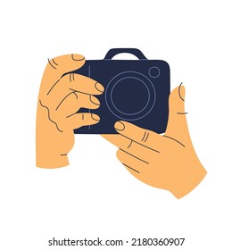 Human hands holds a photo camera. Retro digital device with lens. Hand drawn color vector illustration isolated on white background. Modern flat cartoon style.