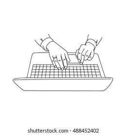 Human hands typing on a laptop keyboard.