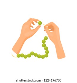 Human hands working with green beads, top view. Handmade bijouterie/jewelry. Hobby and leisure. Flat vector design