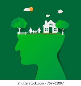 Human head with green house and happy family. Head thinking family. Family with children in the house. Couple standing outside new home.  paper art and craft style.