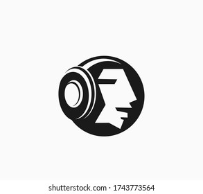 Human head with headphones vector musical icon logo.