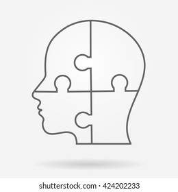 Human head made of puzzle pieces icon