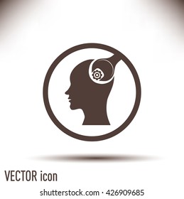 human head and a wrench with a nut