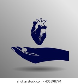 human heart blue on a gray background