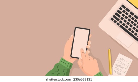 Human holds a smartphone in his hands over a table with a laptop and a notebook. Office work concept. Flat design. Vector illustration