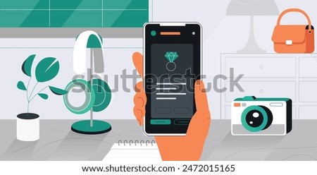 Human holds a smartphone in his hands over a table with a headphone and a camera Office work concept Flat design.