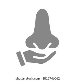 Human nose on hand grey icon. Disease prevention symbol