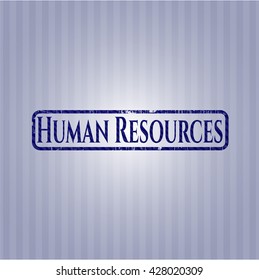 Insignia de recursos humanos con fondo de denim