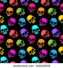 Human skulls seamless pattern. Vector illustration of cute multicolored skulls in engraving technique isolated on black background.