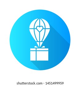 Humanitarian assistance flat design long shadow glyph icon. Delivery aid to people in need. Hot air balloon with box. Emergency relief. Material, food and goods support. Vector silhouette illustration