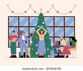 humans celebrating christmas with tree