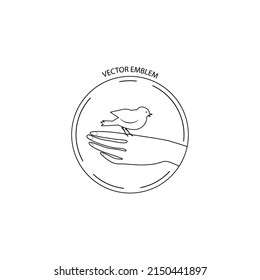 A human's hand is holding  a bird. Vector friendly emblem for logo design . Line style,  Print, graphic style.