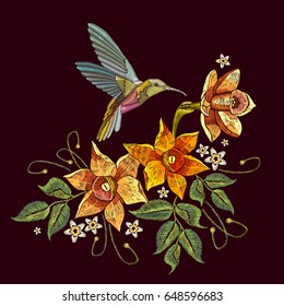 Humming bird and narcissus embroidery. Beautiful hummingbird and yellow narcissus embroidery on black background. Template for clothes, textiles, t-shirt design 