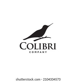 Humming bird sitting on a tree branch Silhouette logo design