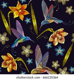 Humming bird and yellow narcissuses embroidery exotic tropical flowers seamless pattern. Beautiful flowers embroidery, humming-bird, orchids, tropical flowers 