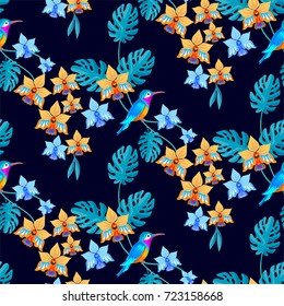 Hummingbird and tropical flowers and palm leaves seamless pattern.