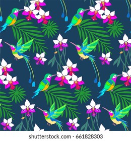 Hummingbirds and palm leaf and tropical flowers seamless pattern background