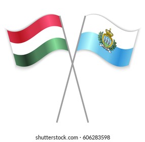 Hungarian and Sammarinese crossed flags. Hungary combined with San Marino isolated on white. Language learning, international business or travel concept.