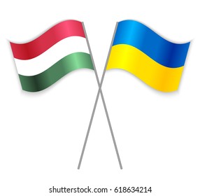 Hungarian and Ukrainian crossed flags. Hungary combined with Ukraine isolated on white. Language learning, international business or travel concept.
