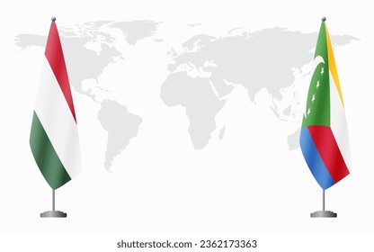 Hungary and Comoros flags for official meeting against background of world map.