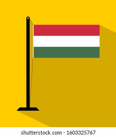 hungary flag on pole, isolated on yellow background