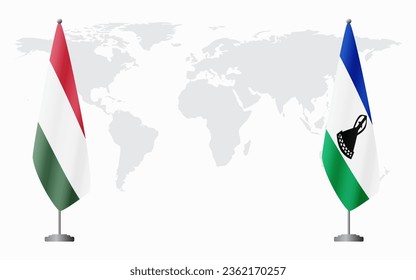 Hungary and Lesotho flags for official meeting against background of world map.