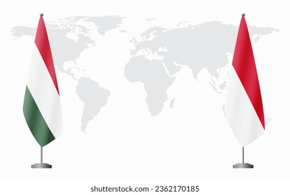 Hungary and Monaco flags for official meeting against background of world map.