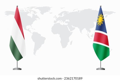 Banderas de Hungría y Namibia para una reunión oficial en el fondo del mapa mundial.