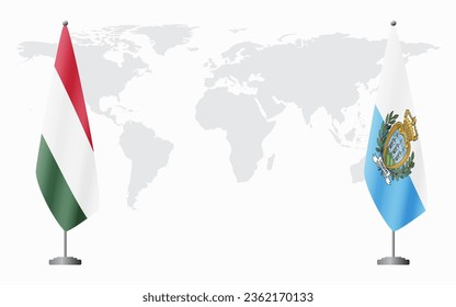 Hungary and San Marino flags for official meeting against background of world map.