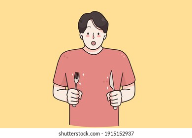 Hunger, appetite, surprise concept. Young hungry man cartoon character with knife and fork in hands standing feeling shocked with tasty meal vector illustration 