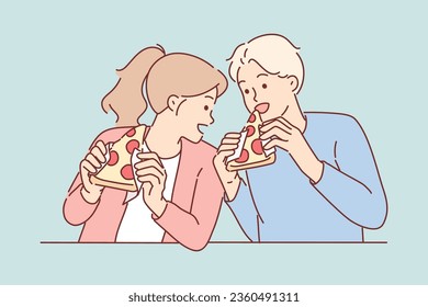 Hungry friends eat pizza and bite into italian appetizer with tomatoes or pepperoni with appetite. Satisfied man and woman ordered pizza in pizzeria with delivery, have lunch together