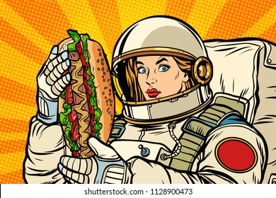 Hungry woman astronaut with hot dog. Pop art retro vector illustration vintage kitsch drawing