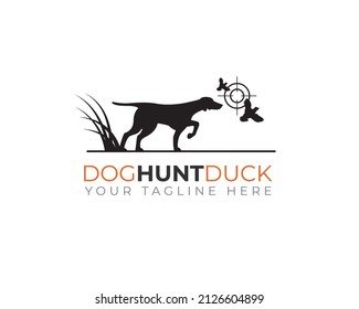 hunter dog showing ready to attack pose with two duck being target aim	
