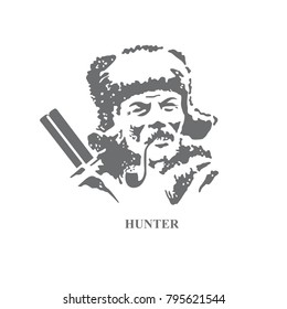 Hunter with a gun and a pipe in the winter.