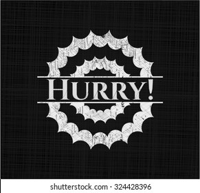 Hurry! written on a chalkboard