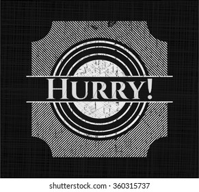 Hurry! written on a chalkboard