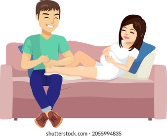 Husband Doing Foot Massage To His Pregnant Woman Wife