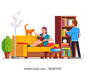 Husband and wife relaxing and reading at home living room. Man picking book from wooden bookcase, woman lying on sofa petting domestic cat distracting her. Flat vector illustration isolated on white.