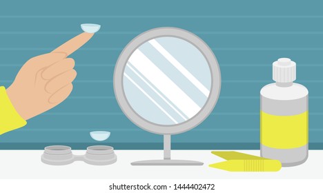 Hydrogel contact lenses for vision correction. A liquid lens, container for storage, mirror and tweezers. The lens care. Place for putting on lenses.
