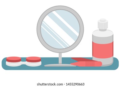 Hydrogel contact lenses for vision correction. A liquid lens, container for storage, mirror and tweezers. The lens care. Place for putting on lenses.