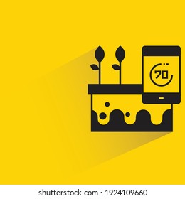 hydroponic system and smartphone sensor with shadow on yellow background