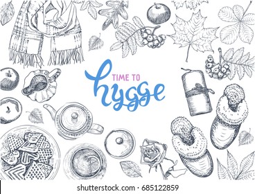 Hygge is a Danish living concept. Vector template with hand drawn illustrations cozy home things: candles, scarf, slippers, tea and cookies, autumn leaves, apples. Sketch style and lettering.