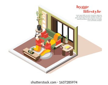 Hygge lifestyle isometric composition with couple comfortably sitting home on floor rug sipping hot chocolate vector illustration  