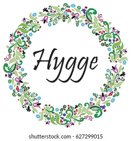 Hygge sign symbolizing Danish Life style surrounded by colorful  floral wreath elements in the shape of a circle 